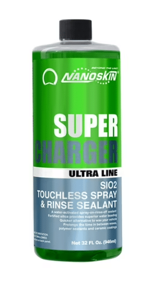 A green bottle of Nanoskin Super Charger SI02 Touchless Spray & Rinse Sealant. The bottle has a black cap and white text on the front, indicating it is a 32 fl oz product in the Ultra line.