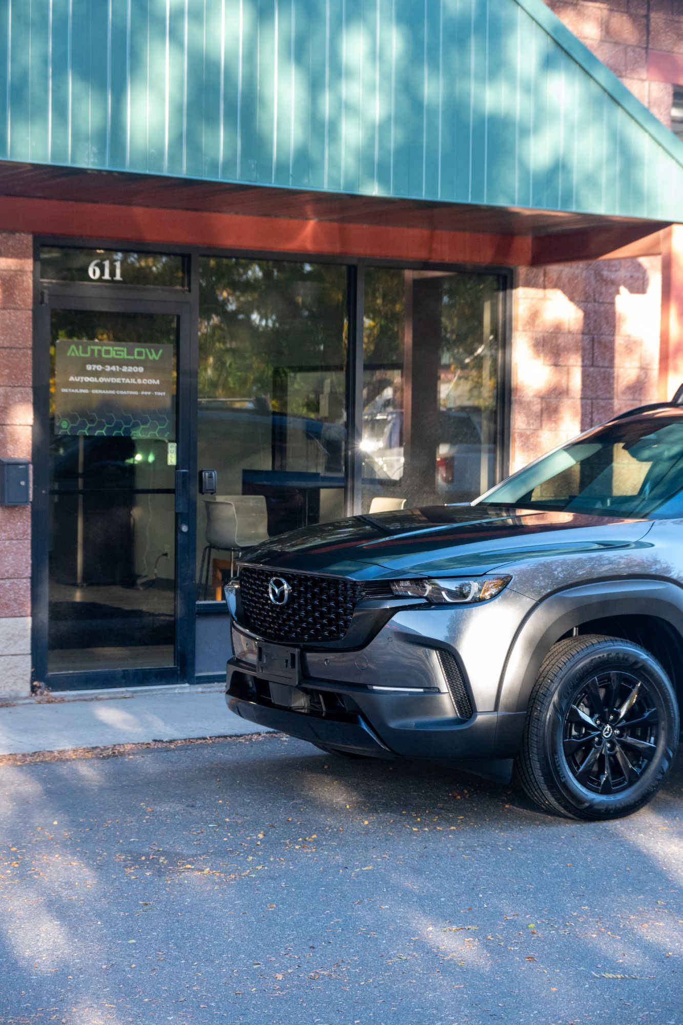 2026 Mazda CX-50 outside the AutoGlow Detailing shop