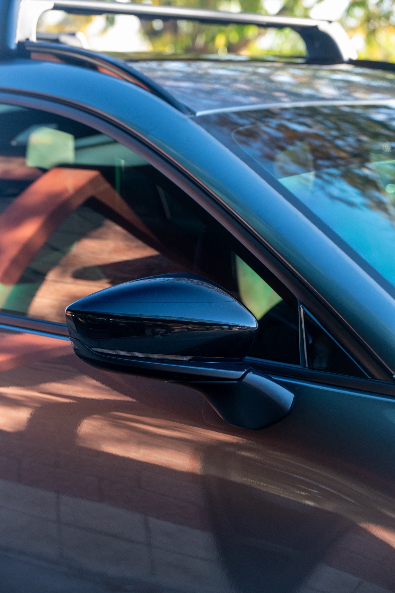 Piano black A-pillar and mirror on a 2026 Mazda CX-50